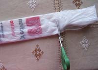 cutting handles off plastic bags to make plarn